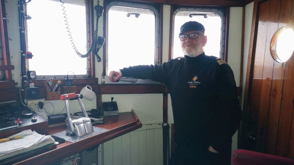 The Captain Next To The Steering Wheel Ready for Whale Watching
